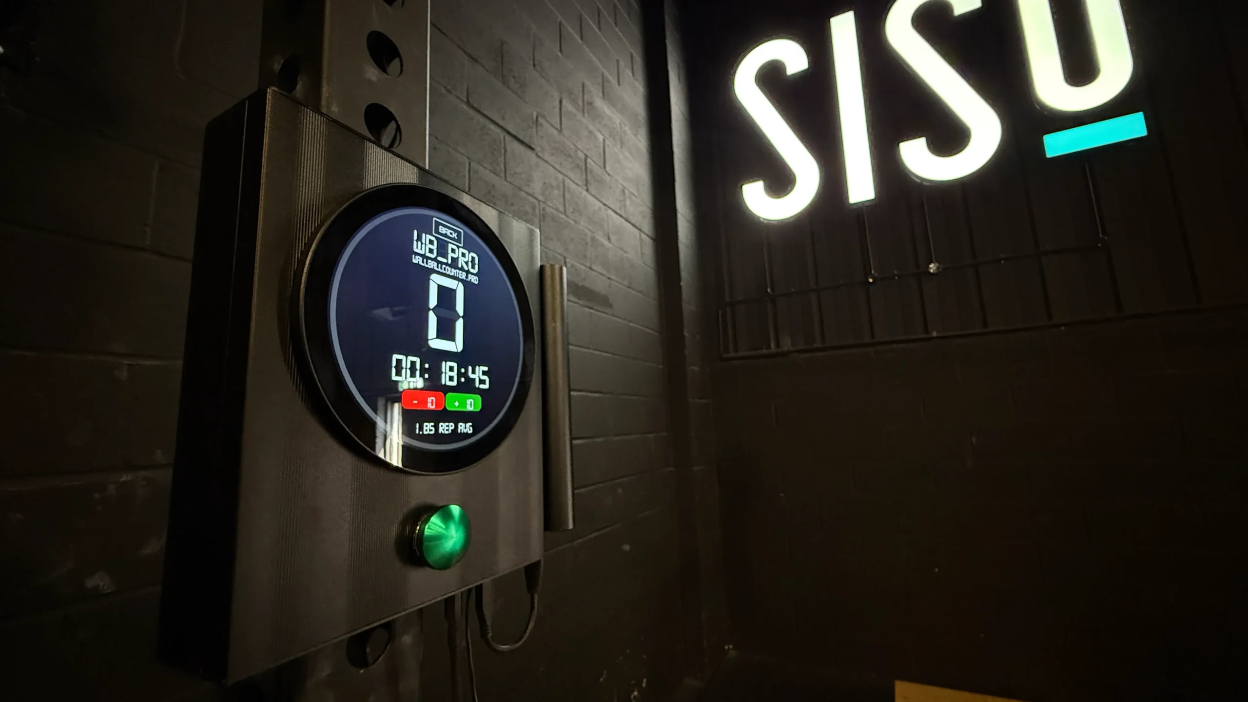 Wallball Counter mounted to gym rig with gym sign in the background